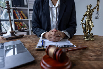 Close up of lawyer or business woman judge working with lawbook in the office or courtroom. gavel...