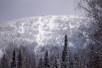 ski resort, ski lift in snowy weather