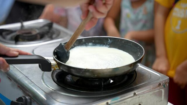 making the traditional milk candy in the Philippines, pastillas