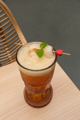 Lychee iced tea with mint leaves

