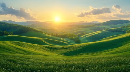 Obraz premium Rolling green hills at sunset with a golden sky.