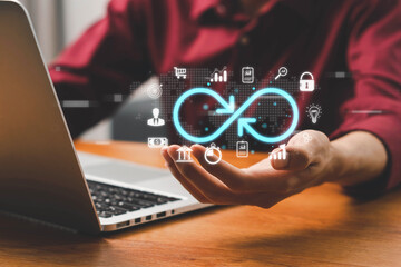 Concept of technology data link and global virtual internet connection. Businessman touch virtual infinity with icon showing digital link tech or global networking, digital marketing,big data.