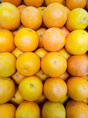 pile of fresh oranges in the supermarket