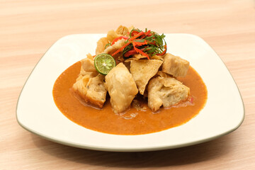 Batagor, made from fish or chicken dumpling, tofu, tapioca flour served with peanut sauce. Indonesian food
