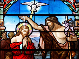Stained glass of Baptism of Jesus by John the Baptist in the Jordan river.