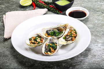 Open half oysters with green onion