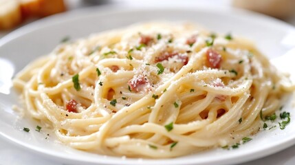 Creamy spaghetti carbonara served on a white plate