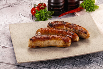Delicous natural roasted sausages in the plate