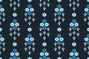 Ikat geometric folklore ornament Seamless pattern with decorative flowers on a dark blue background. Vector illustration.Aztec style. Folk embroidery. design for texture, fabric, clothing, wrapping