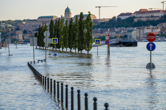 Budapest, Hungary - September 19, 2024: Rising Waters Flood the Highway Outside Budapest's Parliament in the Aftermath of Storm 'Boris'. Buda castle on the background.