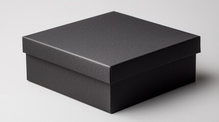 Fototapeta premium A sleek black box with a textured surface, perfect for storage or gift-giving, showcasing modern, minimalist design.