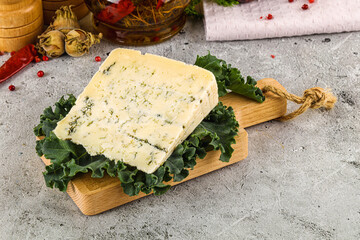 Blue cheese piece over board