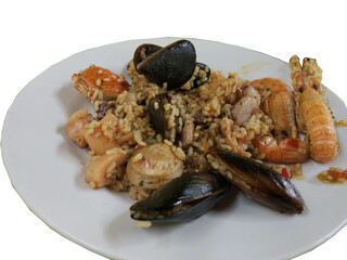 Close-up of a traditional seafood paella, featuring a rich mix of rice, prawns, mussels, clams, and squid. A classic Spanish dish known for its vibrant flavors and Mediterranean ingredients