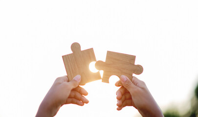 Teamwork jigsaw puzzle, joining hands together, love, cooperation and unity in working together