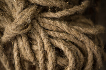Pieces of rope on a wold wooden background.