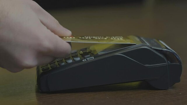Close-up shot of person using mobile payment PayPass.
