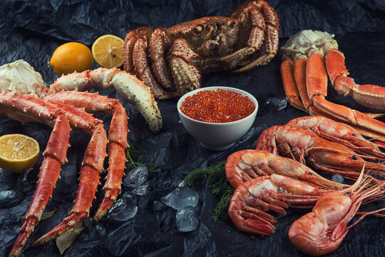 Set of fresh seafood on black background
