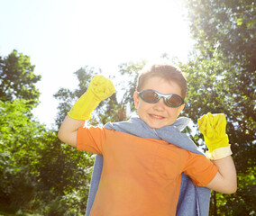 Kid, boy and superhero portrait outdoor with fantasy game, play or pretend character with smile....