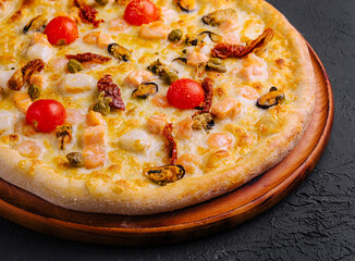 Seafood pizza on wooden board
