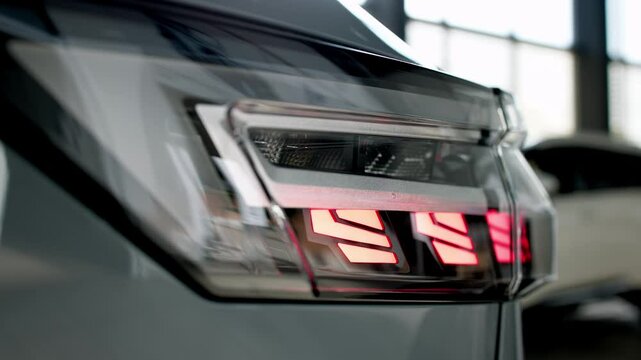 Close-up of advanced car headlight technology in a modern car interior. The sleek design illuminates the road, showcasing innovation and enhancing nighttime visibility.