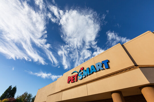 Beaverton, OR, USA - September 28, 2024 - Famous pets store chain Petsmart signage on on its store building captured at sunny fall day with beautiful blue sky. high quality picture for download	
