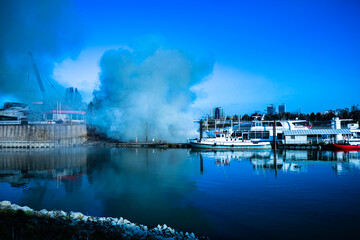 Naklejka premium burning boat on the river