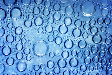 Water rops on blue background.