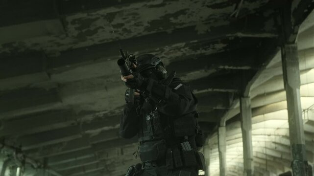 Quick reaction force operator in black military outfit and an m4 assault rifle with a green laser running in an abandoned warehouse