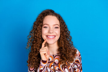 Photo portrait of pretty young girl minded touch chin wear trendy colorful outfit isolated on blue color background