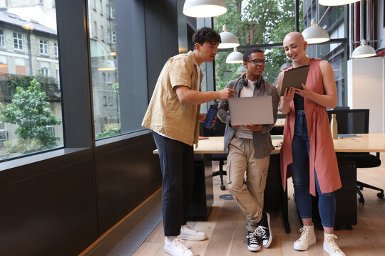 Group of business people discuss in office