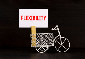 Flexibility symbol. Concept word Flexibility on beautiful white paper on clothespin. Beautiful...