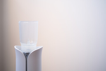 The nebulizer for inhalation is on the table. Treatment of colds and coughs during the disease...