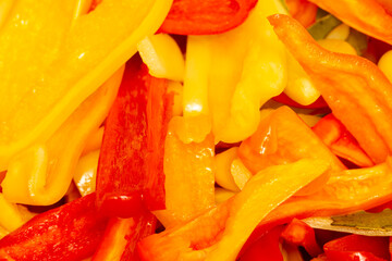 A bright combination of freshly cut red and yellow bell peppers