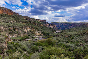 Hell's Gate National Park is a national park situated near Lake Naivasha in Kenya. The park is named after a narrow break in the cliffs, once a tributary of a prehistoric lake that fed early humans in