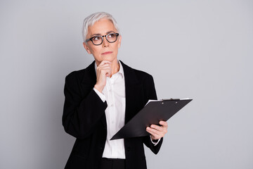 Photo of pretty senior female professional entrepreneur read contract minded wear formalwear specs...