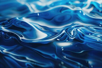 Obraz premium A close-up shot of a blue liquid surface with waves and ripples