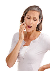 Mature woman, studio and toothache or pain with dental injury, infection and emergency on white background. Female person, gum problem and oral care with worry for cavity decay, irritation and crisis