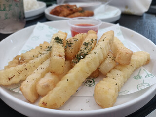 Delicious French Fries served with spicy sauce
