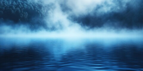 Fototapeta premium Deep blue water of a lake with mist rising in the early morning light, Blue Water, Misty lake