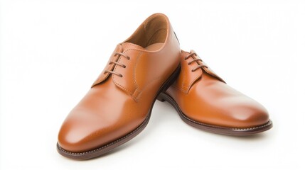 Fototapeta premium A pair of polished leather shoes, isolated on a white background.