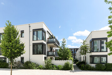 Residential area with ecological and sustainable green residential buildings, low-energy houses with apartments and green courtyard