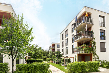 Residential area with ecological and sustainable green residential buildings, low-energy houses with apartments and green courtyard