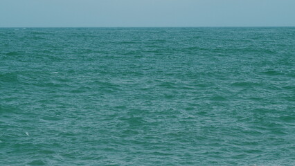 Obraz premium Powerful Ocean Waves Crushing On A Black Coast With Foamy White Texture. Waves With Foam Whitecaps And Splashes.