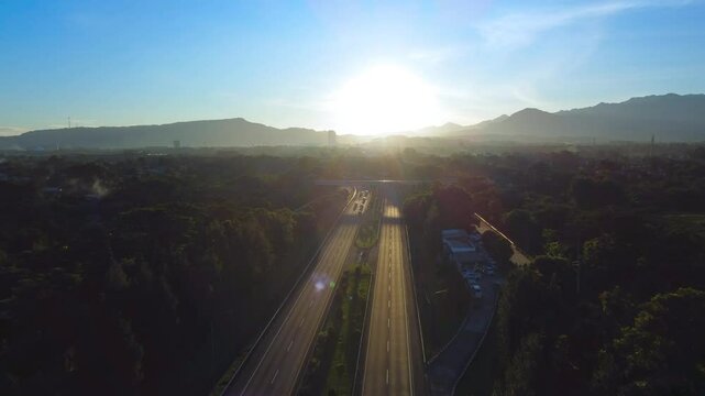 Sunrise or Sunset. Beautiful view of the highway at sunrise in the morning. Aerial drone view of the South Sentul toll road in Bogor City.
