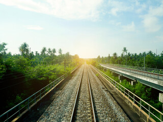 Obraz premium Railway tracks on the bridge in rural area