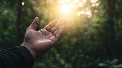 Hands of Islamic man raised in prayer with a background of soft light representing hope and spiritual peace during the holy month of Ramadan