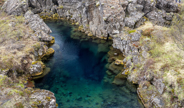 cold, clear turquoise water in the Peningagj&aacute; fissure, Thingvellir (&THORN;ingvellir) National Park, Iceland