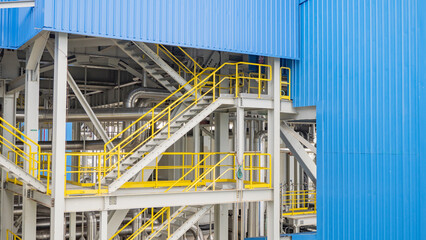 Industrial Structure with Stairs and Pipes.  An industrial structure featuring a set of stairs and pipes, highlighting the intricate details of industrial design and construction.