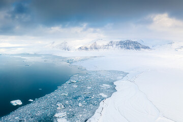 Iceland. An aerial view of an iceberg. Winter landscape from a drone. Jokulsarlon Iceberg Lagoon....