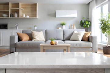 Empty white table top blurred interior living room with grey sofa background.png